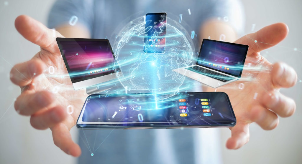 Modern devices connected in businessman hand