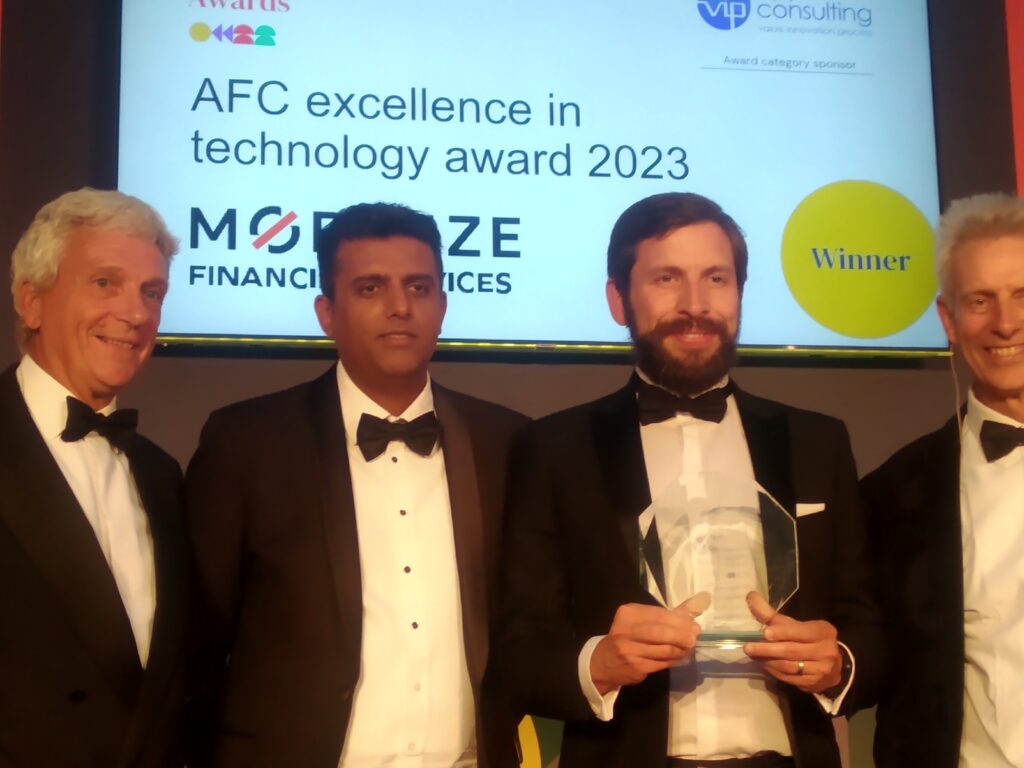 Our Managing Director, Daypesh Patel and the winner of the AFC Excellence in Technology Award 2023 Mobilize Financial Services IS Team.